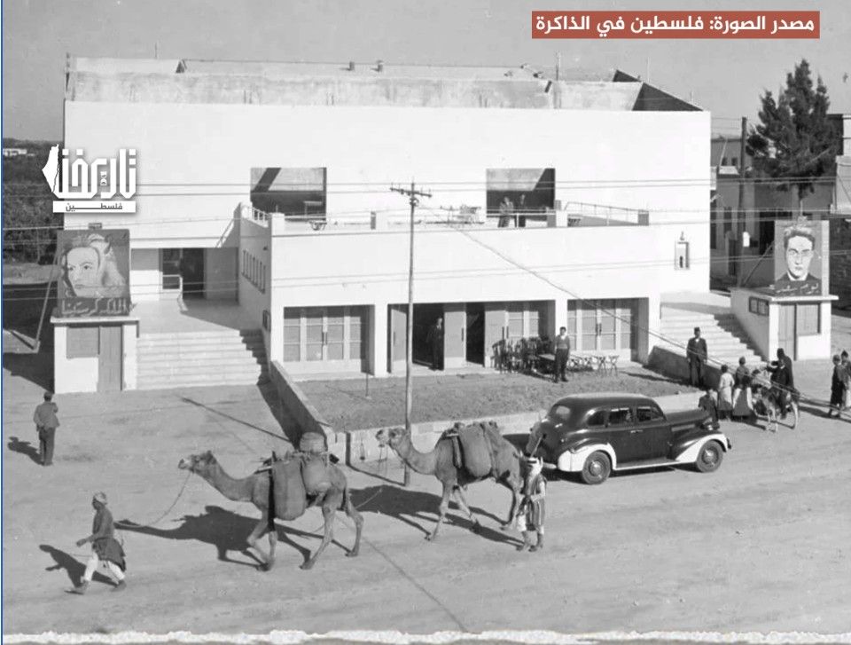 Cinema Alsaamir on Omar Al Mukhtar Street, Gaza, in 1944 — the first cinema in the Gaza Strip, with camels and a car passing on the street.